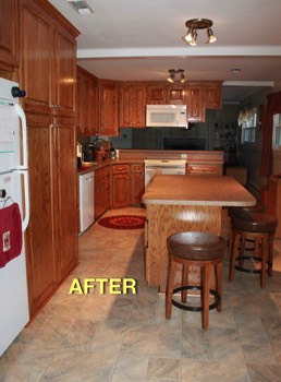  The new, spacious kitchen after the wall was removed as part of the complete remodel (including new countertops, cabinets, flooring, lighting, painting)! 
