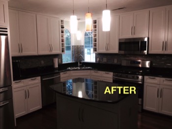  WOW...Elegant new cabinets (note the wine bottle cubby) and new lighting fixtures, too! 